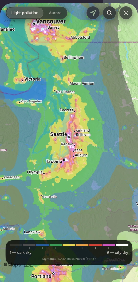 The Sky map over Puget Sound: light pollution from NASA night-light data as a coloured overlay, city sky over Seattle and Tacoma, darker sky toward the Olympic Peninsula